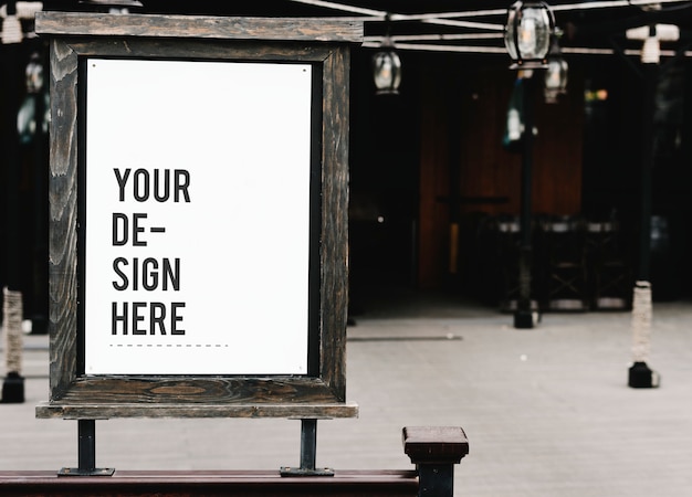 Rustic wooden signboard mockup at a restaurant