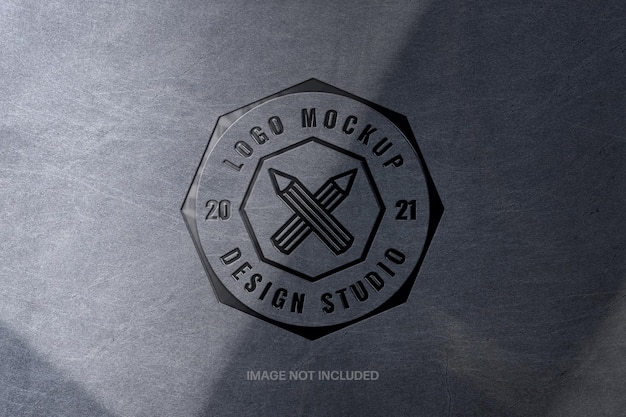 Scratched metallic pressed logo mockup