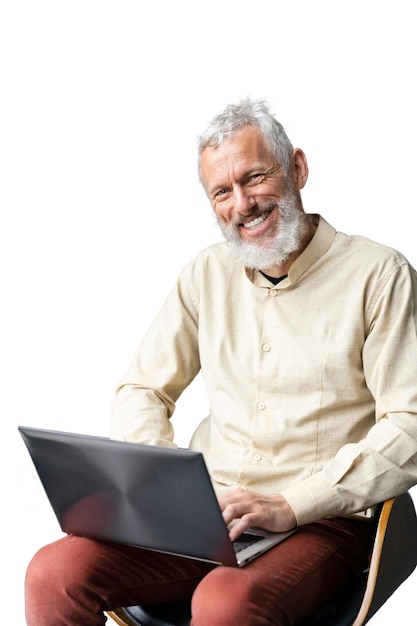 Free PSD senior man using laptop