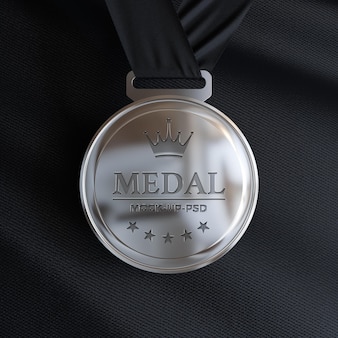 Silver medal mockup on black fabric