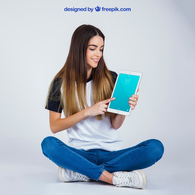 Sitting woman with tablet