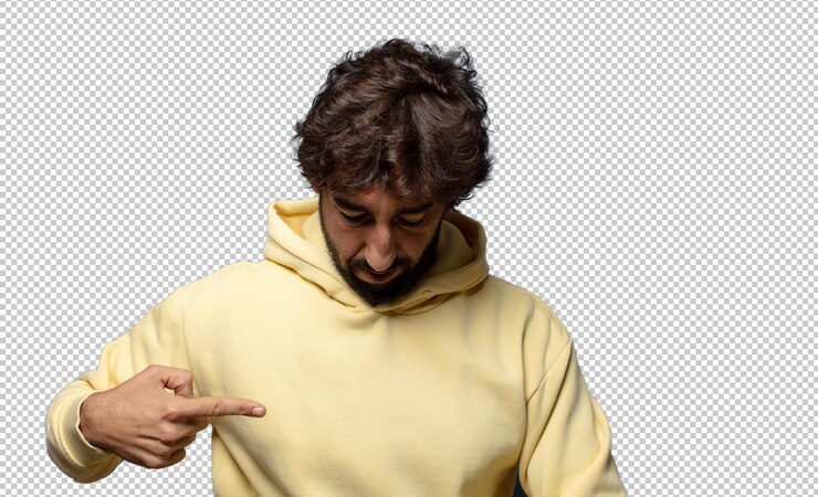 Free PSD smiling cheerfully and casually looking downwards and pointing to chest