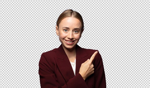 smiling cheerfully feeling happy and pointing to the side and upwards showing object in copy space