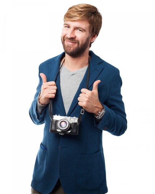 Smiling man with an old camera