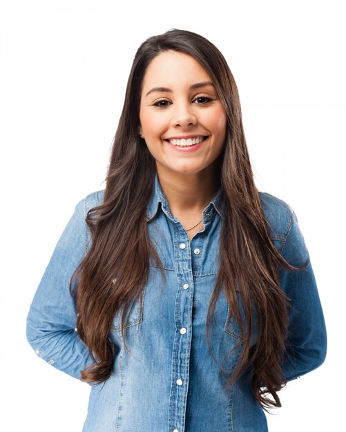 Smiling young woman with hands on her back