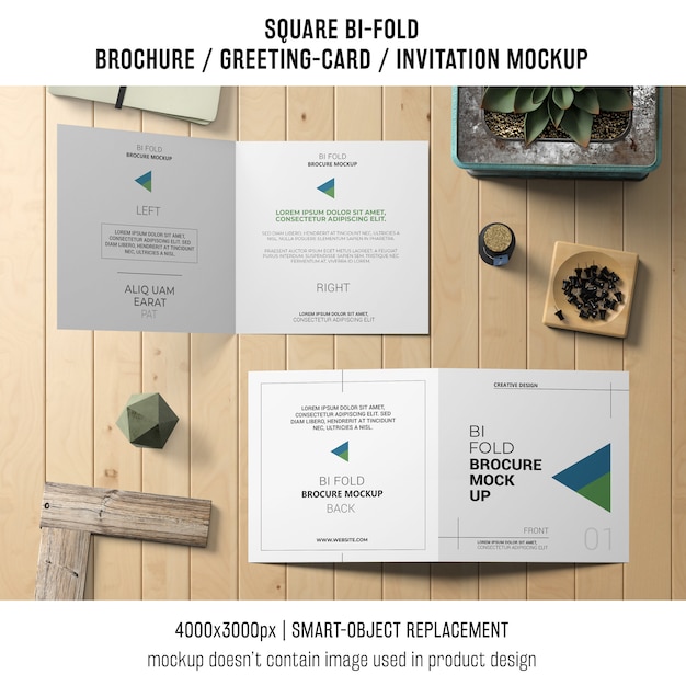 Square bi-fold brochure or greeting card mockup on wooden table