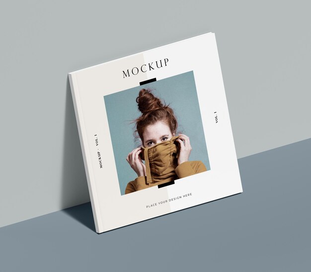 Square book with woman editorial magazine mock-up leaning on the wall