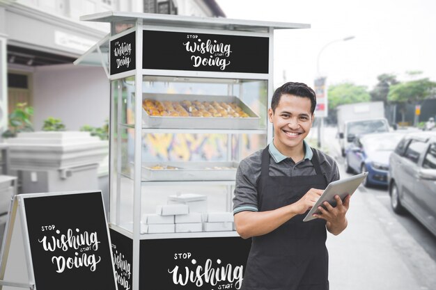 Download Female entrepreneur with her small business food stall mockup | Premium PSD File