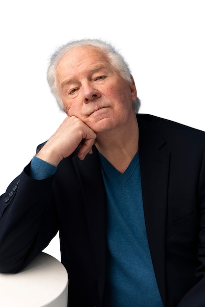 Studio portrait of elderly man