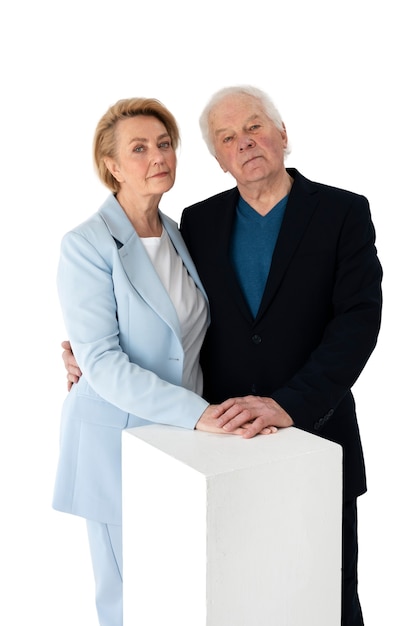 Studio portrait of loving elderly couple