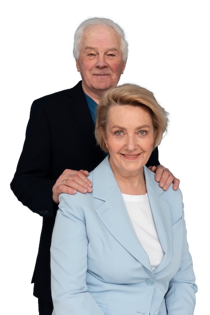 Studio portrait of loving elderly couple