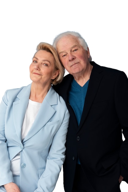 Studio portrait of loving elderly couple