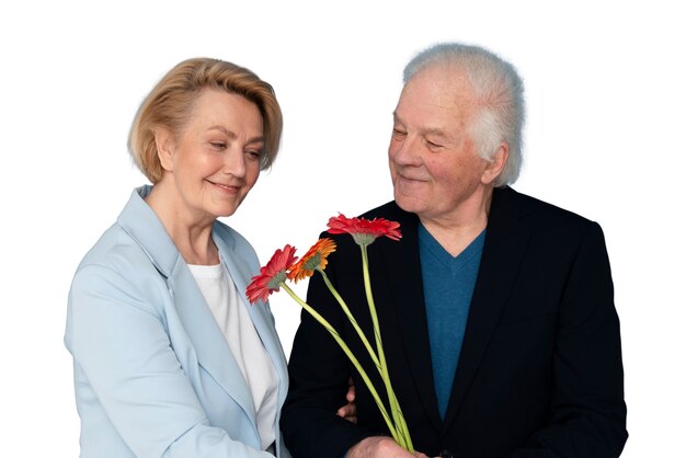 Studio portrait of loving elderly couple