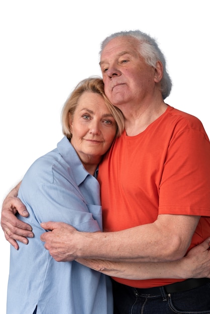 Studio portrait of loving elderly couple