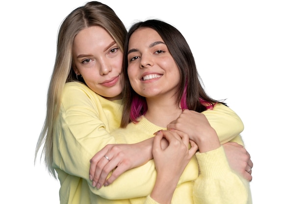 Free PSD studio portrait of two young teenage girl friends