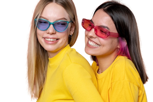 Studio portrait of two young teenage girl friends