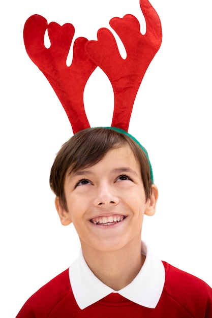 Studio portrait of young girl with antlers