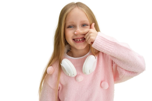 Studio portrait of young girl with headphones