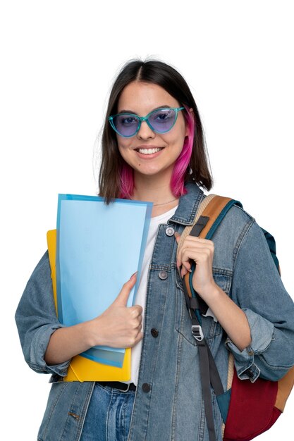 Studio portrait of young teenage girl with backpack
