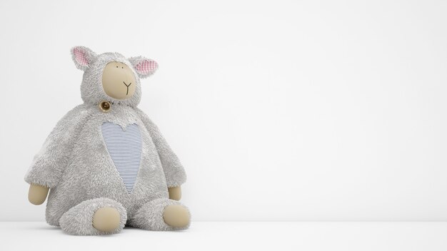 Stuffed animal toy over white wall with copyspace