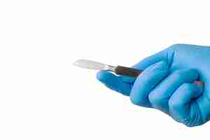 Free PSD surgical scalpel held by hand with glove