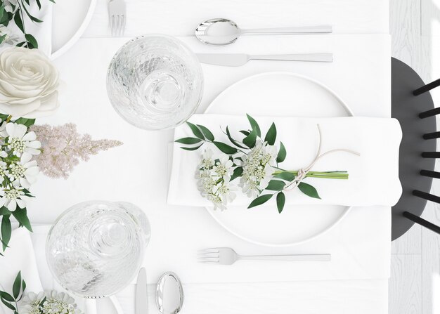 table prepared to eat with cutlery and decorative flowers on top view