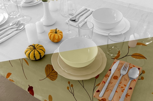 Thanksgiving dinner table arrangement with cutlery and glasses