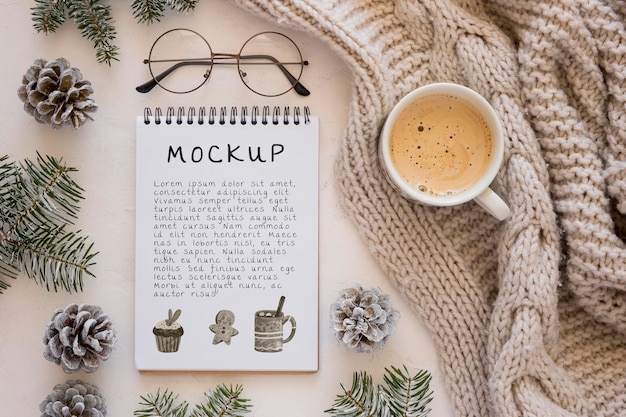 Top view of notebook with coffee and glasses