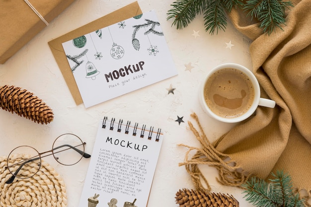 Top view of notebook with scarf and coffee