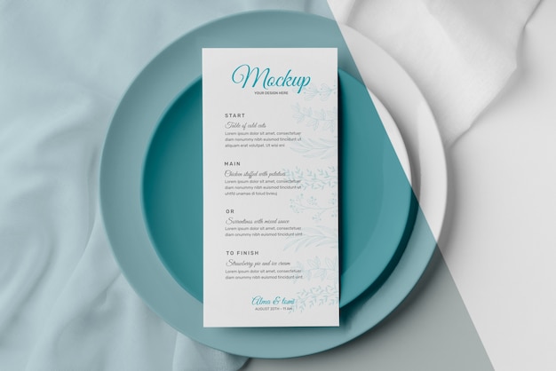 Top view of table arrangement with plates and spring menu mock-up
