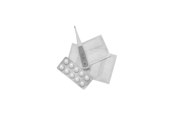 Top view on thermometer with pills