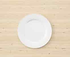 Free PSD top view white plate on wooden table