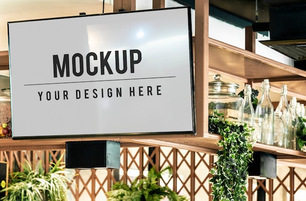 Free PSD tv screen mockup in a restaurant