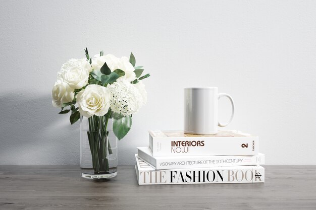 vase with flowers, mug and stacked books