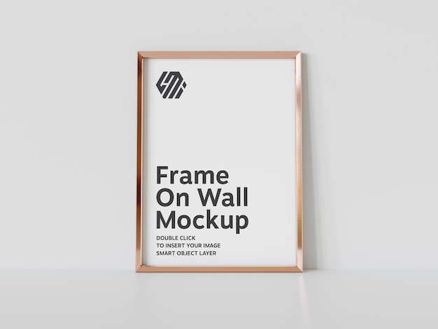 Vertical golden frame leaning on floor mockup