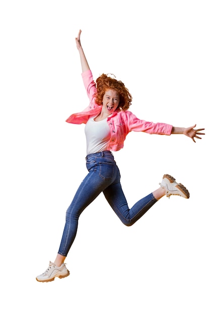 view of happy woman jumping in mid-air