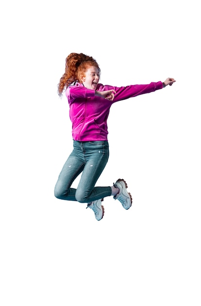 View of happy woman jumping in mid-air