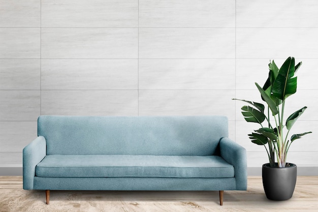 Free PSD wall mockup psd with blue sofa in living room