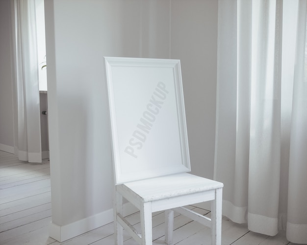 Free PSD white frame on chair mock up
