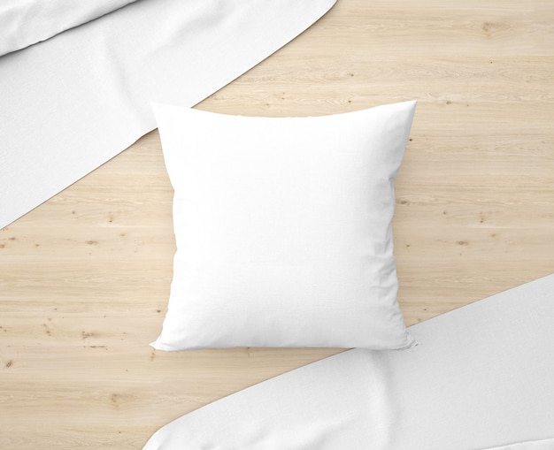 Белая подушка с простынями на полу
