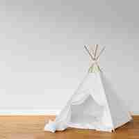 Free PSD white teepee on wooden floor