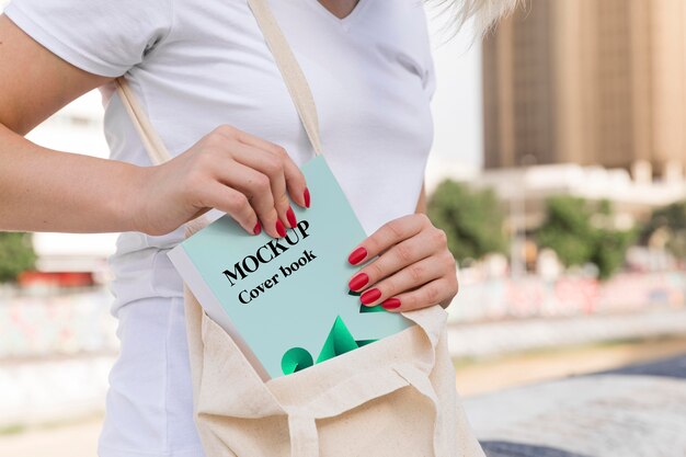 Woman reading book on street