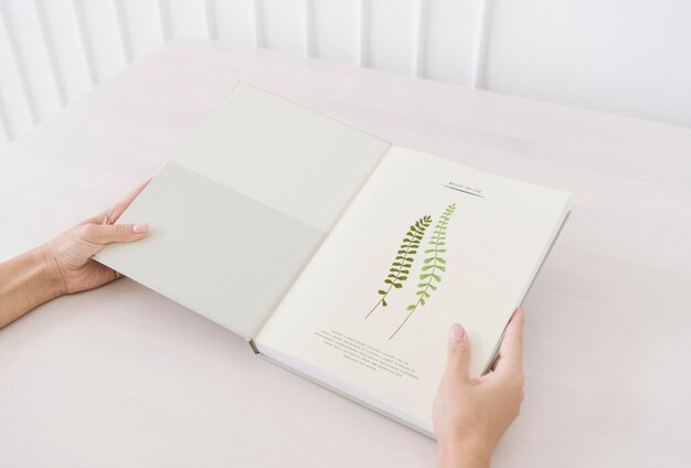 Woman reading a botanical book mockup