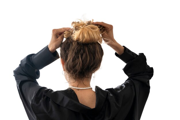 woman wearing messy bun hairstyle