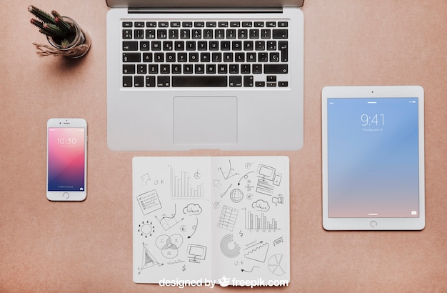 Workspace mockup with laptop and tablet