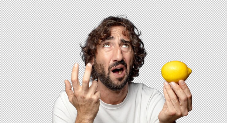 Free PSD young adult bearded man holding a lemon