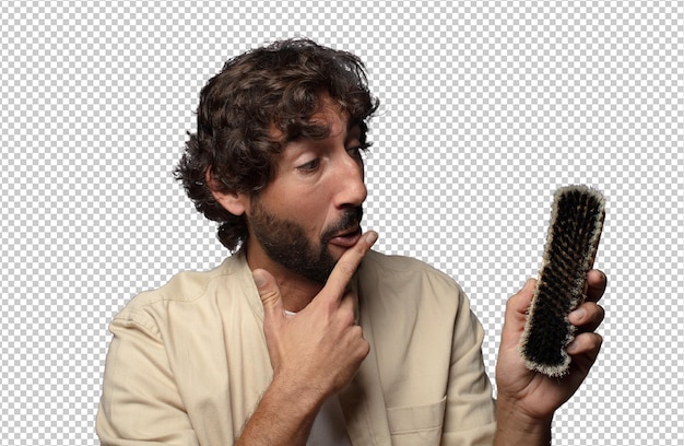 young adult bearded man with a boots brush