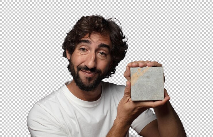 Free PSD young adult bearded man with a stone brick