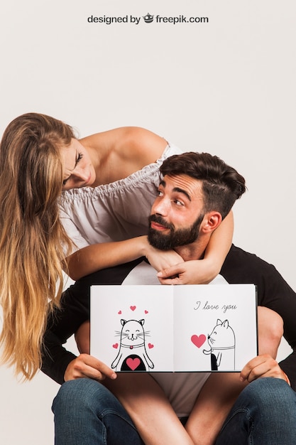 Free PSD young couple holding open book