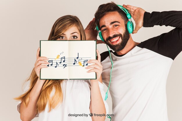 Young couple showing book